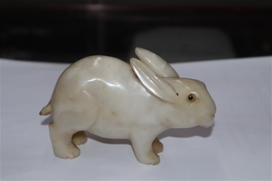 A 19th century Chinese white jade figure of a rabbit, glass inset eyes